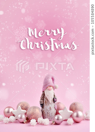 Christmas composition with a gnome and festive decorations on a pink background Christmas composition with a gnome and festive decorations on a pink background 105584890