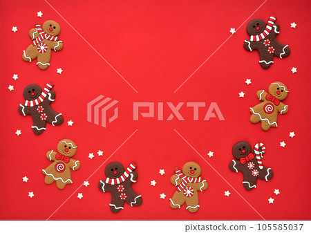 Christmas gingerbread with stars on a red background. Christmas or New Year card. Christmas gingerbread with stars on a red background. Christmas or New Year card. 105585037