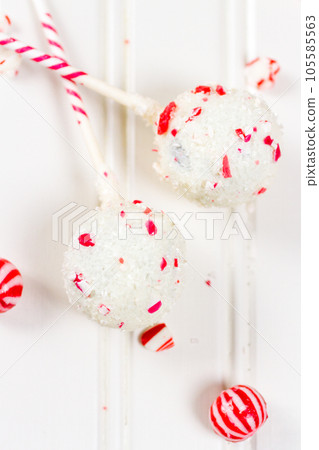 Peppermint chocolate cake pops dipped in white chocolate and candy cane bits. Peppermint chocolate cake pops dipped in white chocolate and candy cane bits. 105585563