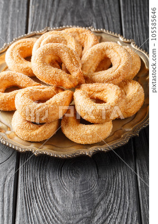 Sweet italian cookies Torcetti Piemontesi closeup on the plate. Vertical Sweet italian cookies Torcetti Piemontesi closeup on the plate. Vertical 105585646