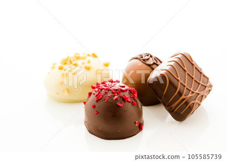 Assortedgourmet chocolate candies in different shapes and colors. 105585739