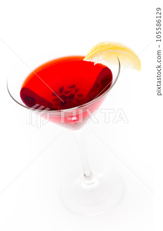 Pomegranate cosmo cocktail with lemon as a garnish. 105586129