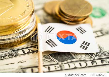 Stack of coins with Korea flag and US dollar banknotes. Stack of coins with Korea flag and US dollar banknotes. 105586520