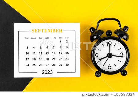The September 2023 Monthly calendar for 2023 year with black colour alarm clock on beautiful background. 105587324