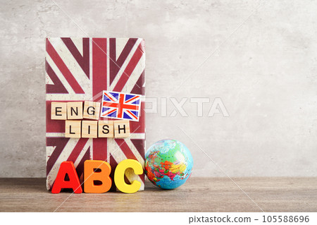Bangkok, Thailand April 1, 2023 English book and piggy bank with globe, learning and tutorial for foreigner. Bangkok, Thailand April 1, 2023 English book and piggy bank with globe, learning and tutorial for foreigner. 105588696