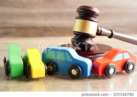 Car accident lawsuit and insurance, Judge hammer with car model. 105588780