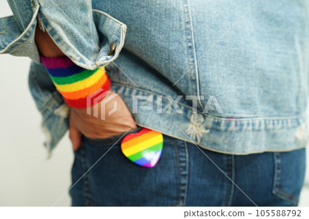 Asian woman with rainbow flag, LGBT symbol rights and gender equality, LGBT Pride Month in June. 105588792