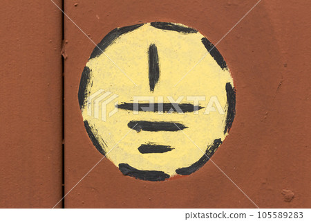 Eectric ground hazard warning sign symbol on a painted metal surface 105589283