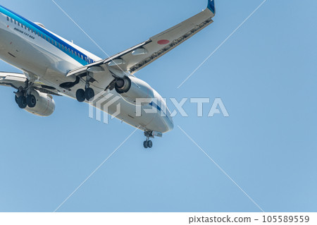 [Back view of ANA aircraft in preparation for landing from the sky above Jonanjima Seaside Park] 105589559