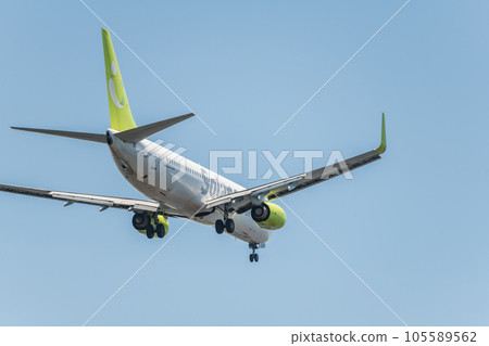 [Back view of Solaseed Air plane landing from the sky above Jonanjima Seaside Park] 105589562