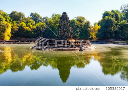 Jayatataka monument, a former Hindu royal temple that is now associated with Buddhist symbols, situated in the center of baray on an island, mirroring the sacred Himalayan lake Anavatapta. 105589917