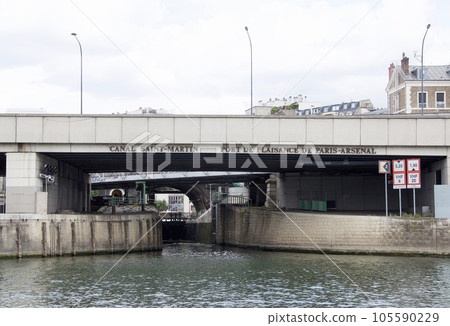 The Seine river entrance in front of the Arsenal locks seen from the Seine river cruise ship in Paris The Seine river entrance in front of the Arsenal locks seen from the Seine river cruise ship in Paris 105590229