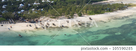 Aerial view of wooden fisherman boats and sandy beach at Kendwa village at sunny day, Zanzibar,Tanzania 105590285