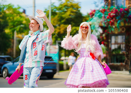 Beautiful barbie girl and boyfriend ken walking around the city Beautiful barbie girl and boyfriend ken walking around the city 105590408