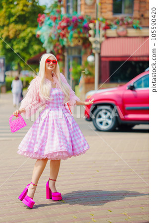 Beautiful barbie girl walking around the city  105590420