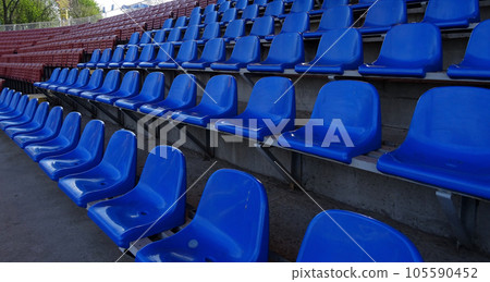 Plastic seating section on the grandstand of sport stadium Plastic seating section on the grandstand of sport stadium 105590452