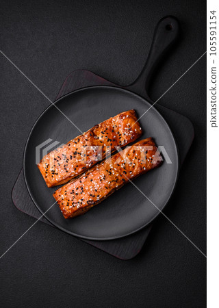 Delicious fresh grilled red fish with salt, spices and herbs Delicious fresh grilled red fish with salt, spices and herbs 105591154