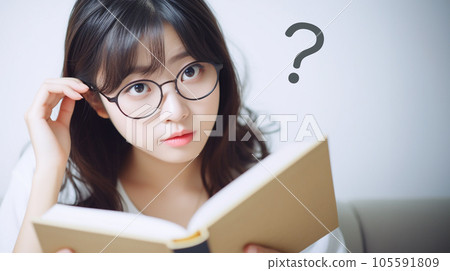 A woman troubled by reading a book A woman troubled by reading a book 105591809