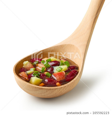 vegetable soup in wooden ladle 105592223
