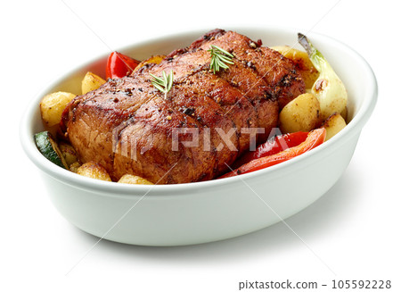 bowl of whole roast pork and vegetables 105592228
