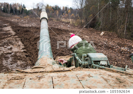 Russian tank rides on a forest road Russian tank rides on a forest road 105592634