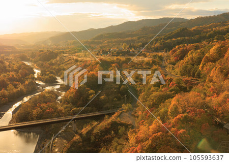 Yubari Shuparo Dam with colored leaves dyed in the setting sun ``Autumn Hokkaido'' Yubari Shuparo Dam with colored leaves dyed in the setting sun ``Autumn Hokkaido'' 105593637