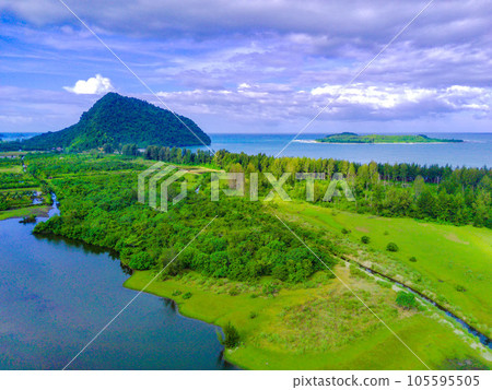 aerial footage of beautiful babah ie village with pond and savannah and pine trees, aceh jaya, Indonesia. aerial footage of beautiful babah ie village with pond and savannah and pine trees, aceh jaya, Indonesia. 105595505