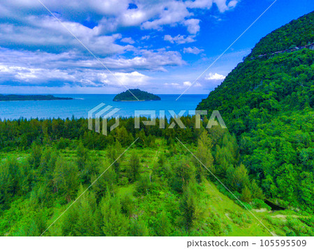 aerial footage of beautiful babah ie village with pond and savannah and pine trees, aceh jaya, Indonesia. aerial footage of beautiful babah ie village with pond and savannah and pine trees, aceh jaya, Indonesia. 105595509