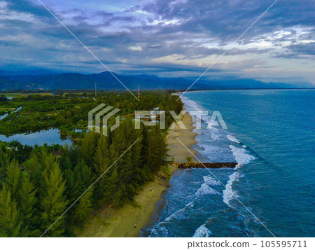 the beautiful Bali Beach in Blangpidie, South West Aceh, Indonesia with blue ocean against the blue sky shot with aerial drone. the beautiful Bali Beach in Blangpidie, South West Aceh, Indonesia with blue ocean against the blue sky shot with aerial drone. 105595711