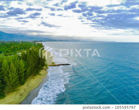the beautiful Bali Beach in Blangpidie, South West Aceh, Indonesia with blue ocean against the blue sky shot with aerial drone. 105595797