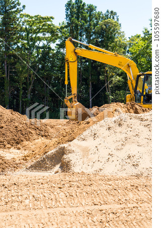 Image of a hydraulic excavator excavating earth and sand in a mountainous area | Image of residential land development | Image of destruction of nature | Construction image Image of a hydraulic excavator excavating earth and sand in a mountainous area | Image of residential land development | Image of destruction of nature | Construction image 105597680