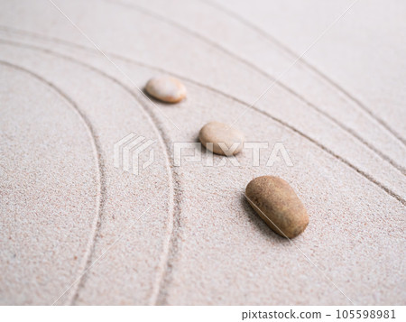 Calm Nature  Japan Concept,Zen Garden Japanese Pattern on Beach Background,Design Buddhism Texture Wave on Desert ,Top View Line Abstract on Sand with Stone,Purity Meditation Balance or Aroma Spa. 105598981