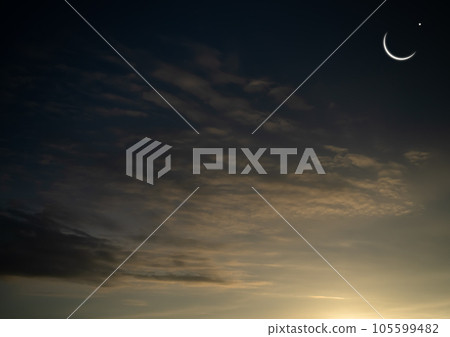 Mubarak Ramadan Month Muslim Islamic Moon Symbols,Crescent Moon and Star on Night Sky Dusk Orange Pink Blue Evening Background,Twilight Free Space for Eid Al Adha,Eid Al Firr,Muharram Religious. 105599482