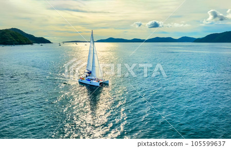 Aerial view of a catamaran on the andaman seas. Sailing in Phuket, Thailand. 105599637