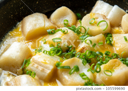 A cooking scene where gluten (grilled gluten) is bound with eggs. A cooking scene where gluten (grilled gluten) is bound with eggs. 105599690