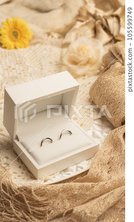 a pair of rings in a box a pair of rings in a box 105599749