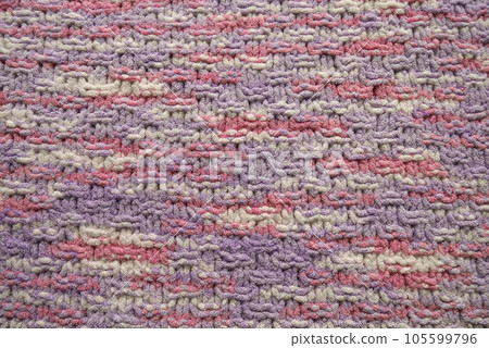 Pink and purple pastel color knitting pattern background 105599796