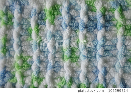 Blue and green Aran braid cable stitch knitting pattern background Blue and green Aran braid cable stitch knitting pattern background 105599814