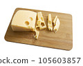 Cheese on a wooden board isolated on white background. Hard cheese cut into pieces. 105603857