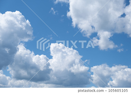 Big white clouds in a blue sky close-up. There is a place for the text. The concept of cleanliness in nature and caring for nature Big white clouds in a blue sky close-up. There is a place for the text. The concept of cleanliness in nature and caring for nature 105605105