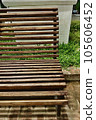 wooden bench in park 105606452
