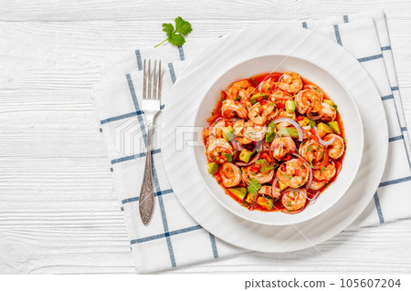 mexican shrimp cocktail salad in a bowl, top view 105607204