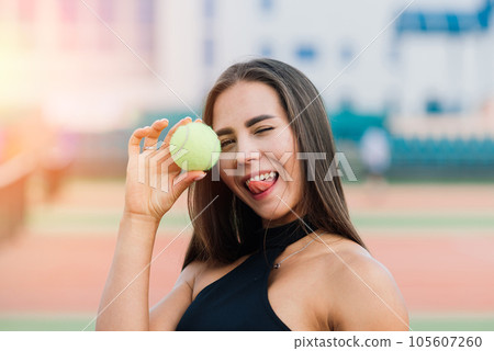 Beautiful stylish sexy woman in trendy sportswear on tennis court. 105607260