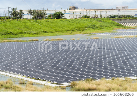 View of the floating Solar power system on the flood detention basin in Kaohsiung, Taiwan. View of the floating Solar power system on the flood detention basin in Kaohsiung, Taiwan. 105608266