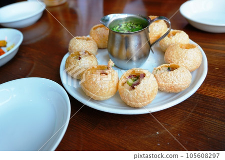 Indian/Nepalese food, street food pani puri Indian/Nepalese food, street food pani puri 105608297