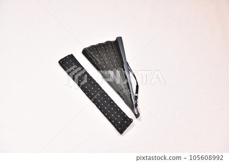 A folding fan that cools you down in the hot summer A folding fan that cools you down in the hot summer 105608992