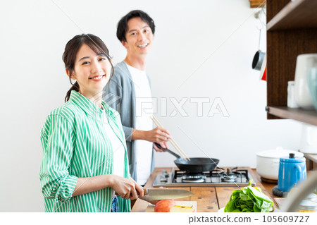 Young couple in the kitchen Young couple in the kitchen 105609727