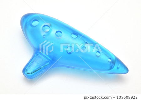 Colorful children's ocarina in blue and translucent colors made of plastic, white background Colorful children's ocarina in blue and translucent colors made of plastic, white background 105609922