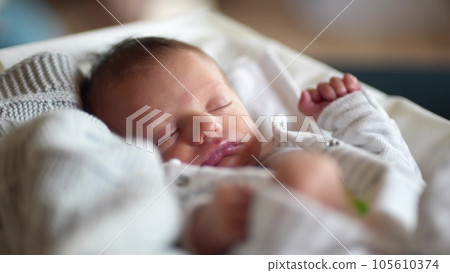 newborn baby sleep. boy infant sleep lies in a child bed. happy family birthday closeup baby lifestyle concept. cute baby close up sleeping in bed at home newborn baby sleep. boy infant sleep lies in a child bed. happy family birthday closeup baby lifestyle concept. cute baby close up sleeping in bed at home 105610374