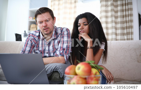 Couple in cozy living room Couple in cozy living room 105610497